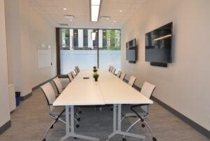 boardroom with table and chairs CORE Commercial Real Estate